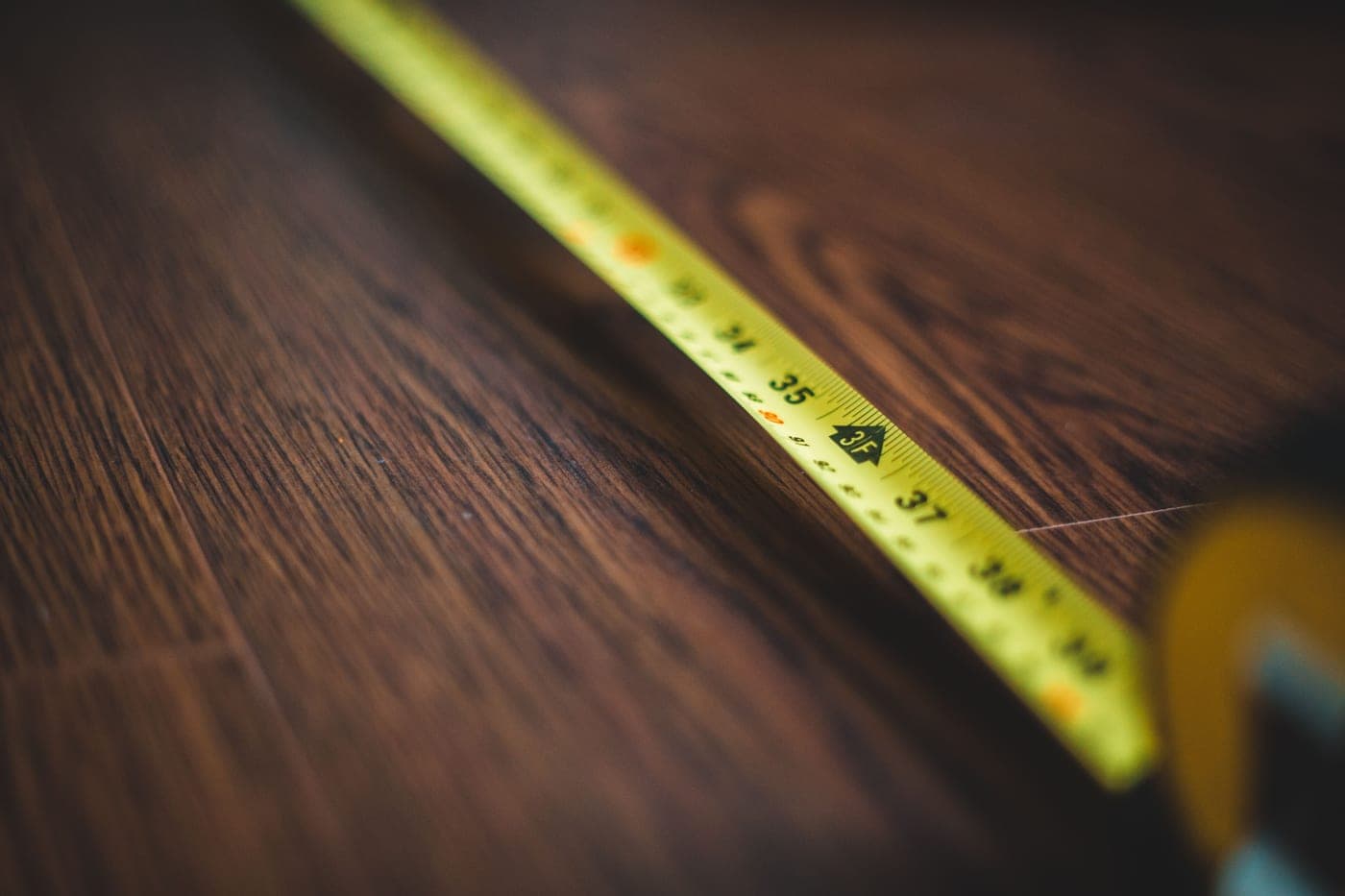 Tape measure on a wooden surface